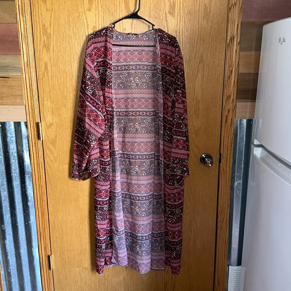 Long cardigan from the brand Feitong. One size.